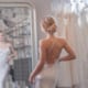 Beautiful bride at the mirror thinking about breast lift surgery